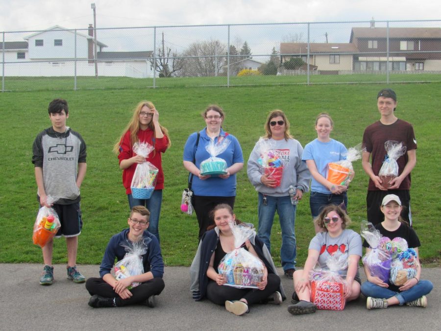 Participants of the 2018 Polio Walk display their winnings from the events annual basket raffle