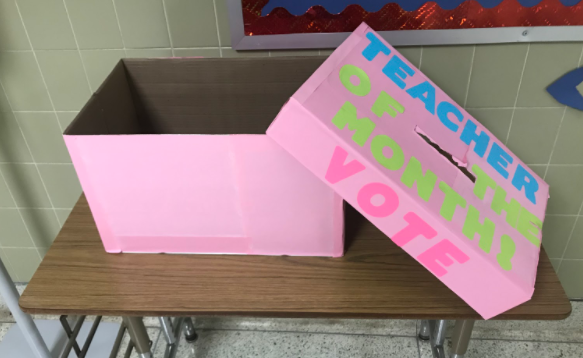 The Teacher of the Month  box sits outside of the office waiting for students to vote for their favorite teacher.