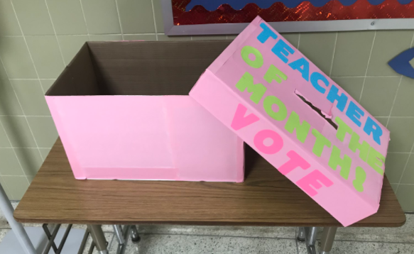 The "Teacher of the Month"  box sits outside of the office waiting for students to vote for their favorite teacher.