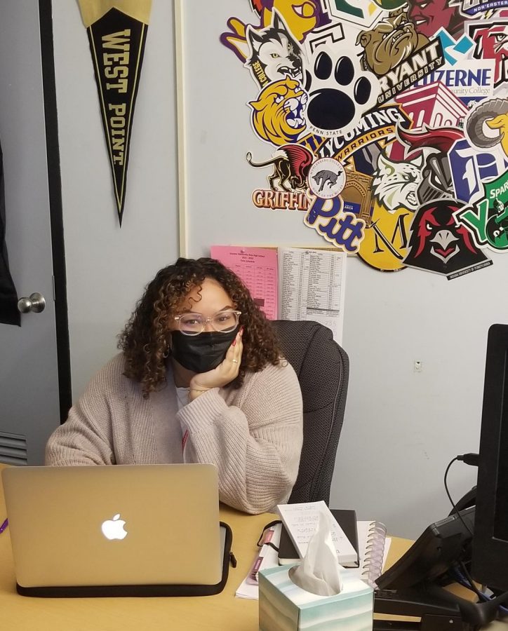 College advisor, Ms. Nin, working at her desk. 