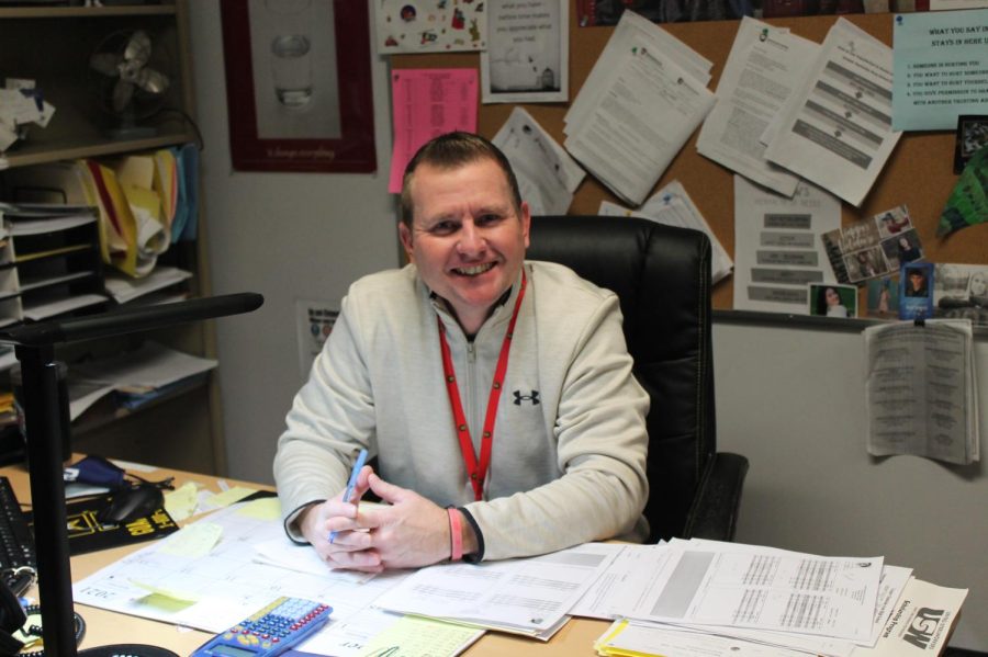 Guidance counselor, Mr. Hischak, working at his desk.