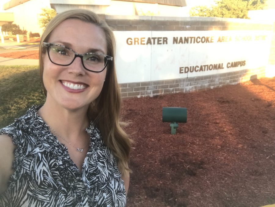Ms. Kingsbury stands beside the GNA School District sign, beaming with pride (Photo from Karissa Kingsbury).