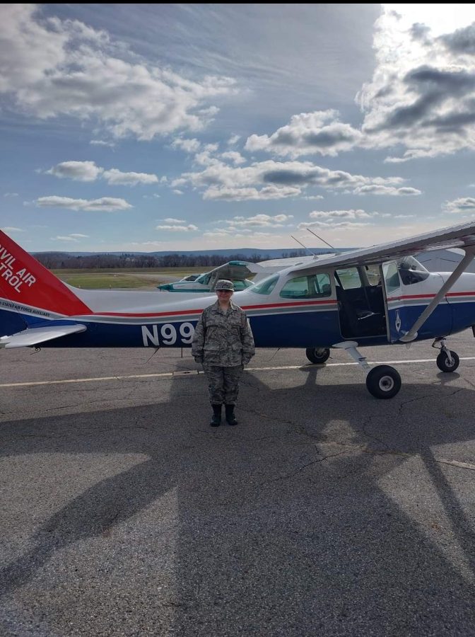 Senior, Annastasia OLooney, posed in uniform in front of her CAP aircraft. 
