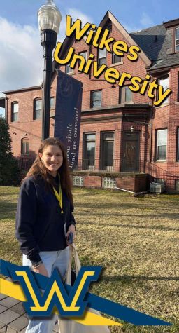 Myla Vnuk, class of 2022, standing in front of her current university. 