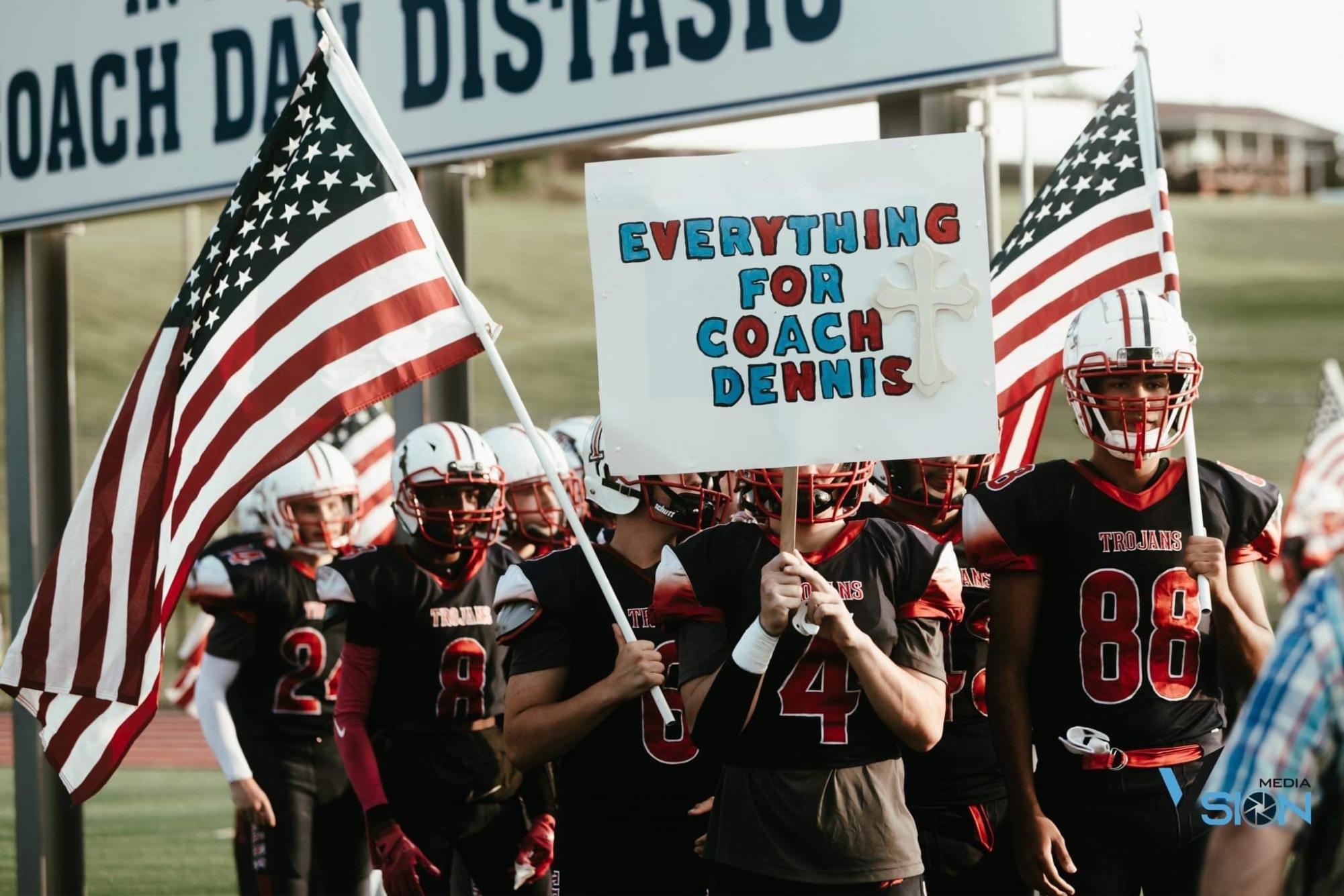 The Nanticoke Trojans display a poster made for Coach Dennis at the football game against North Pocono.